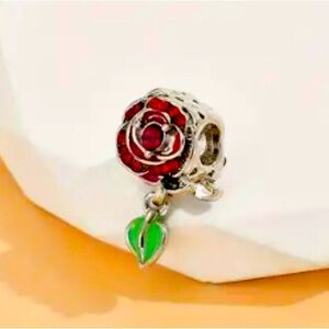 Elegant Silver Rose Charm with Red and Green Accents NWT
